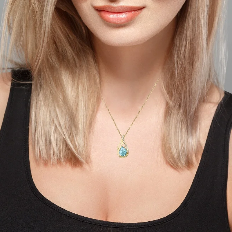 Worn medallion necklaces-Viducci 10k Yellow Gold Genuine Pear-shape Blue Topaz and Diamond Halo Drop Pendant Necklace